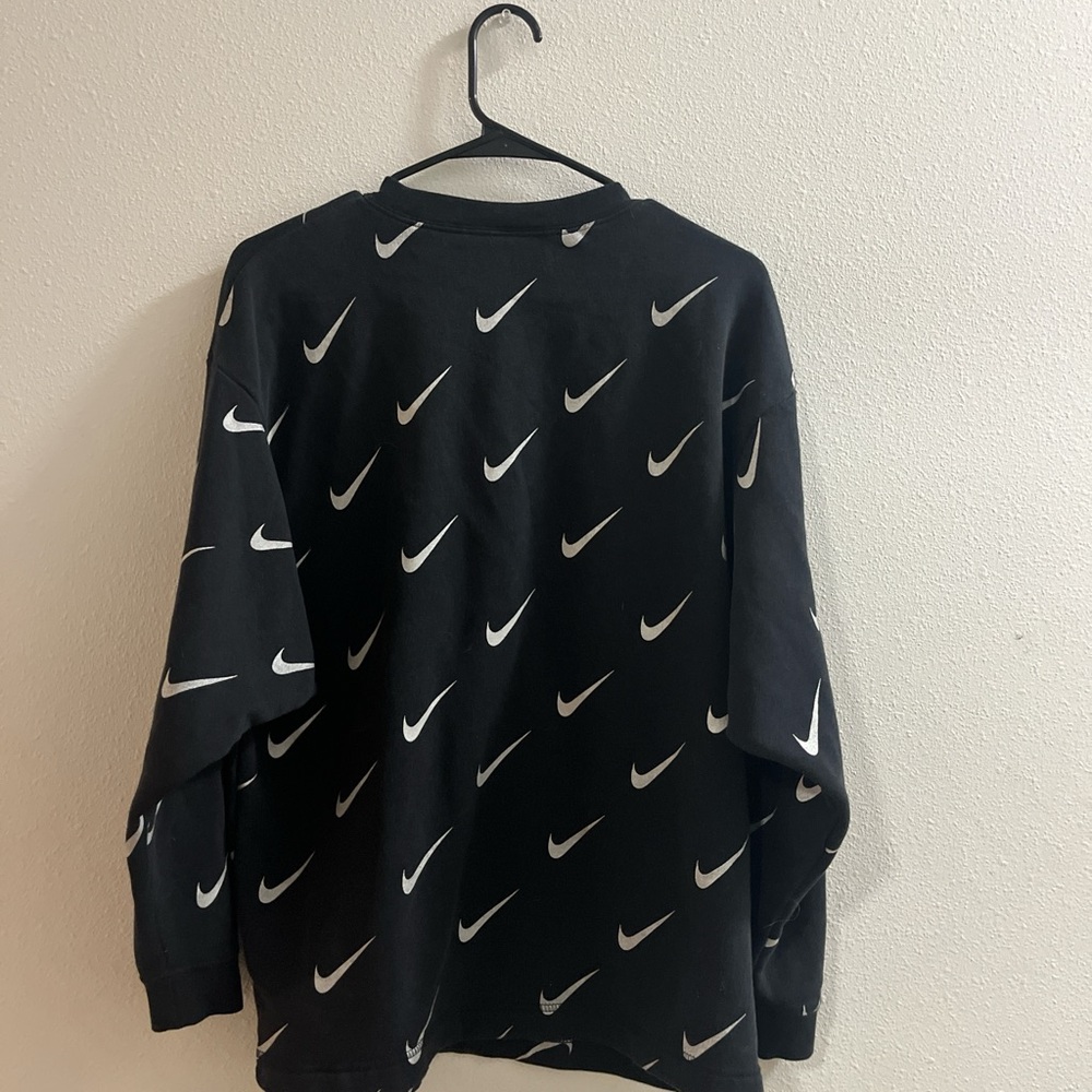 Nike Black Sweatshirt with White Swoosh Pattern